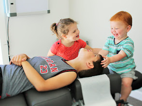 Children enjoying a warm, family-friendly chiropractic visit